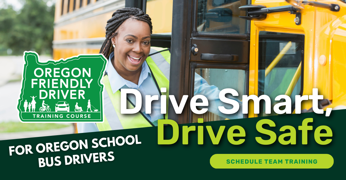 A female school bus driver smiling while posing right at the school bus door